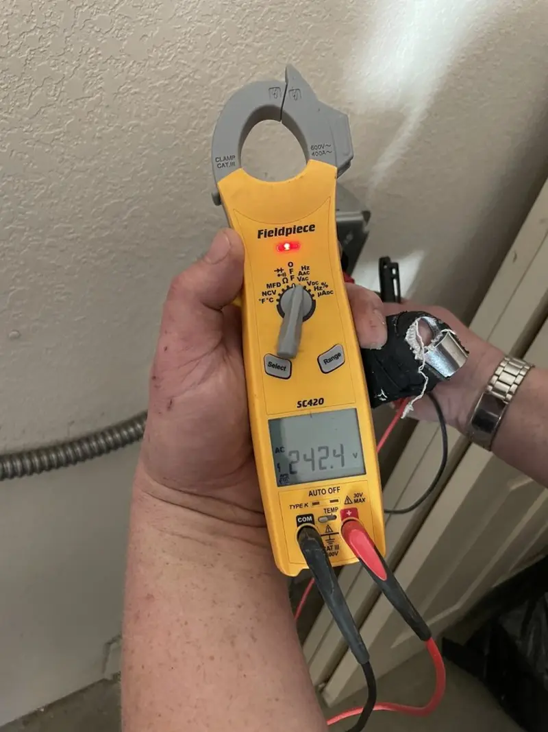 Voltage testing with clamp meter during Electrical Installation Services in Wauconda